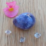 Purple tumbled stone, pink flower and clear crystals