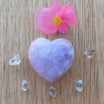Purple heart stone with pink flower and crystals