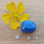 Yellow flower with blue stone and crystals