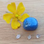 Yellow flower, blue stone and clear crystals