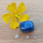 Yellow flower with blue stone and crystals