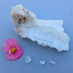 White crystal cluster with pink flower and gems