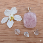 Rose quartz pendant with flower and clear crystals
