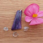 Purple stone pendant with pink flower and crystals
