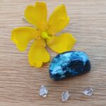 Yellow flower with blue stone and crystals