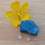 Yellow flower, blue stone and clear crystals