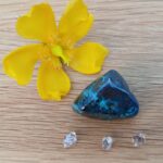 Yellow flower with blue stone and crystals