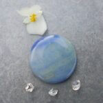 Blue opal gemstone with flower and crystals