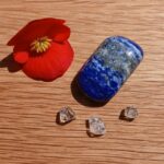 Red flower, lapis lazuli stone and clear crystals