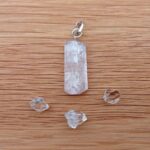 Clear crystal pendant with small quartz stones