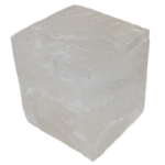 Translucent white cubic mineral crystal on white background