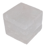 Translucent white mineral cube on plain background