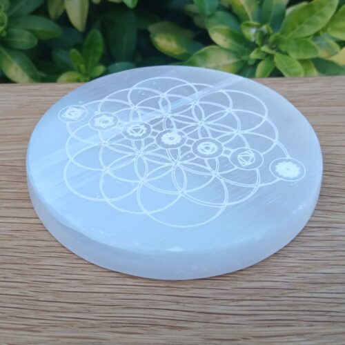 Engraved selenite disc with sacred geometry design